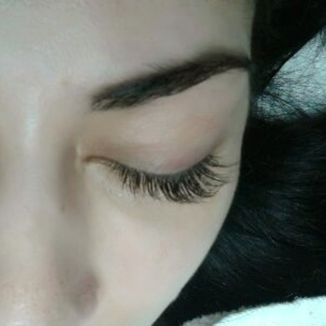 Jennifer Fitzpatrick applying makeup to a client — Lashmajick beauty studio Timonium MD