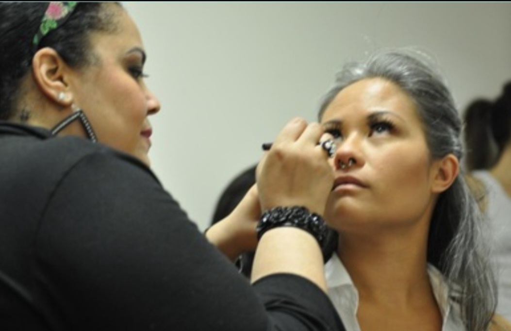 Jennifer Fitzpatrick applying makeup to a client
